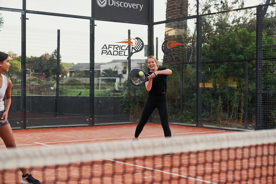 Padel smash with Table Mountain backdrop