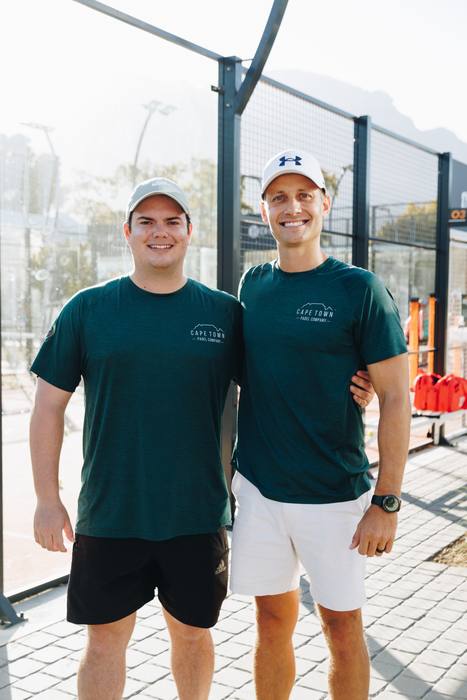 Padel player in action at Camps Bay courts, Cape Town